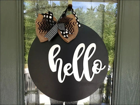 Black circular handmade door hanger with decorative bow, perfect rustic round door decor
